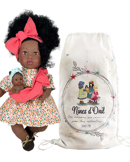 Doll with a baby and branded drawstring bag on a white background