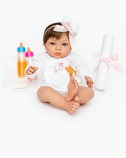 Baby doll with white outfit and headband, surrounded by baby items on a white background