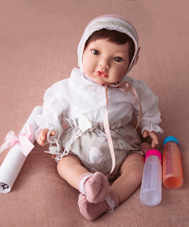 Baby doll with a pacifier and two bottles 