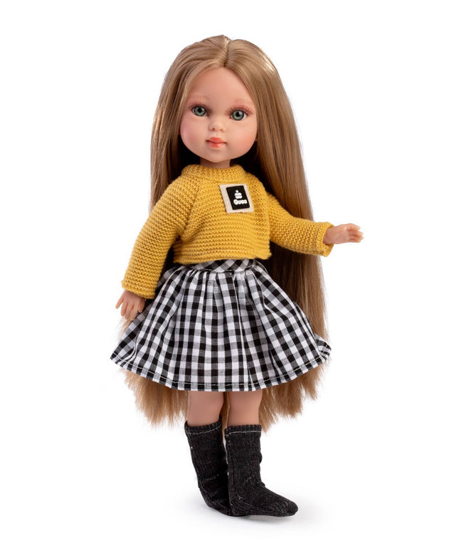 Doll wearing a yellow sweater with a logo and a black and white checkered skirt on a white background