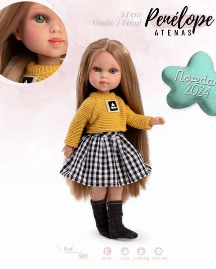 Doll wearing a yellow sweater and checkered skirt with 'Penélope Atenas' branding.
