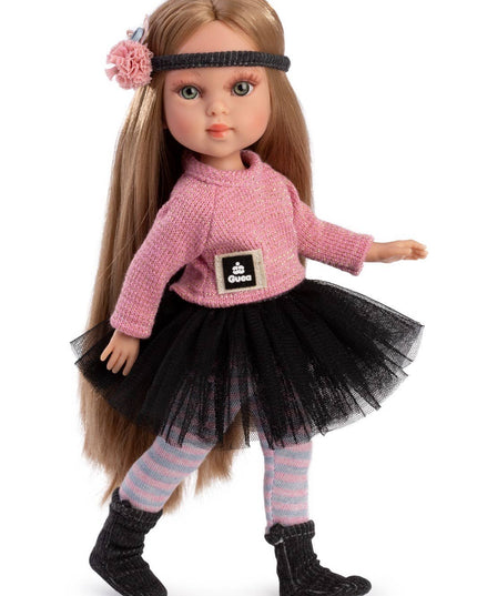 Doll wearing a pink sweater, black tutu, and striped leggings on a white background