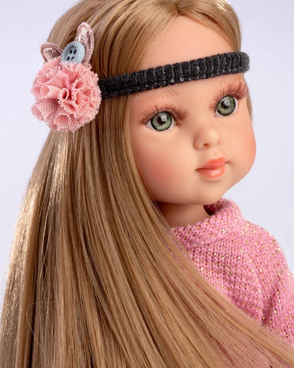 Doll with pink hair accessory and headband on a light gray background