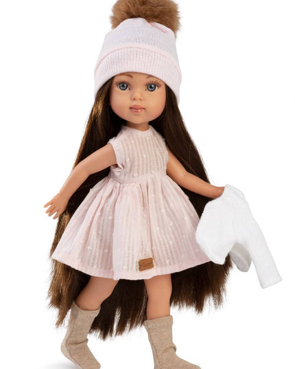 Doll with long dark hair, wearing a pink dress, white shoes, and a pink hat with a brown pom-pom on a white background.