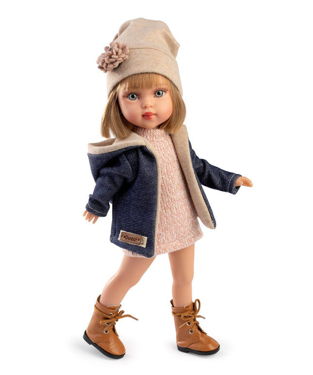 Doll wearing a coat, hat, and boots on a white background