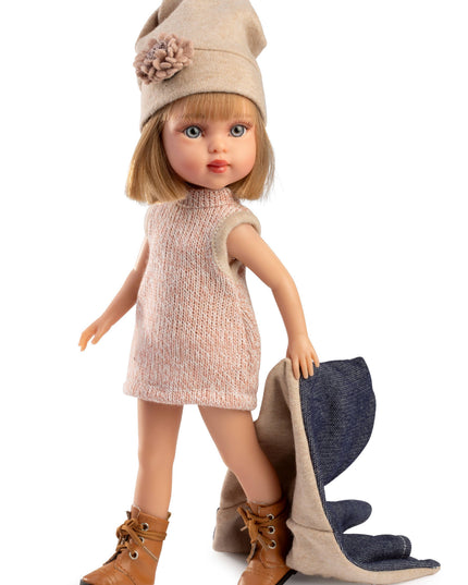 Doll wearing a beige dress, hat, and boots with a white background