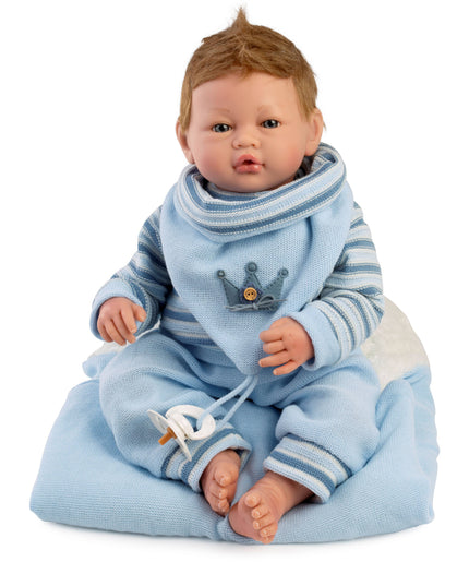 Baby doll in blue outfit with a crown emblem on a white background