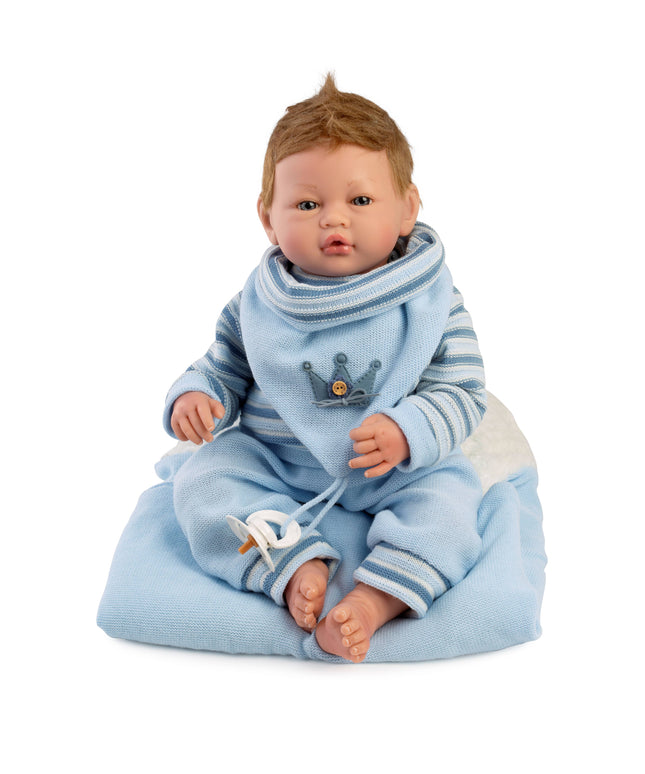 Baby doll in blue outfit with a crown emblem on a white background