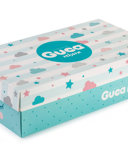 Carton box with Guca Reborn branding and colorful design on a white background