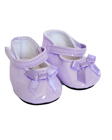 Pair of purple shoes with bows on a white background