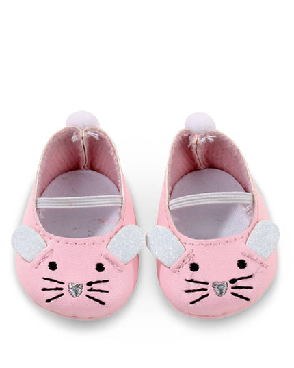 Pink baby shoes with cat face design on a white background