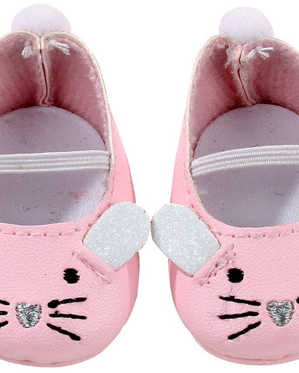 Pink baby shoes with cat face design on a white background