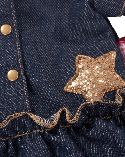 Close-up of a denim jacket with a gold star patch and a visible brand tag.