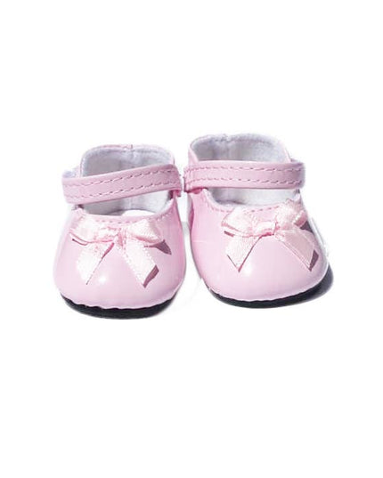 Pair of pink baby shoes with bows on a white background