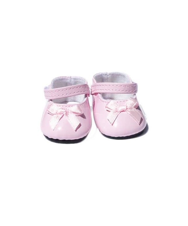 Pair of pink baby shoes with bows on a white background