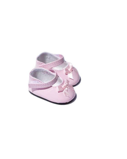Pair of pink baby shoes with bows on a white background
