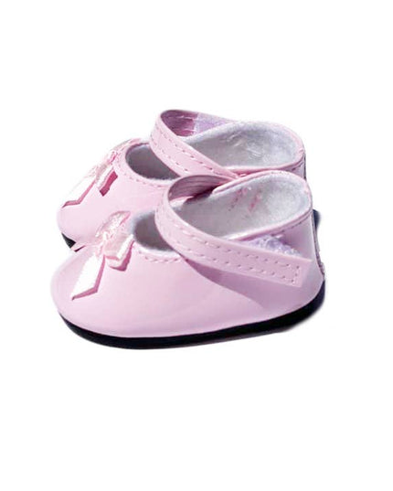 Pink baby shoes with a bow on a white background