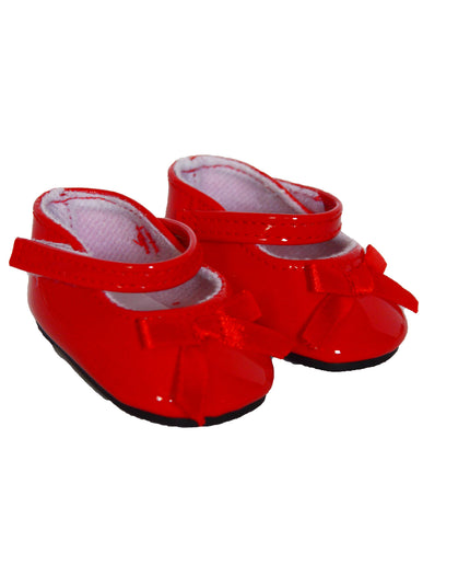 Red shoes with bows on a white background