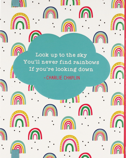 Notebook cover with rainbow pattern and Charlie Chaplin quote