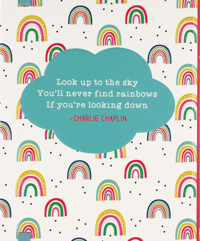 Notebook cover with rainbow pattern and Charlie Chaplin quote