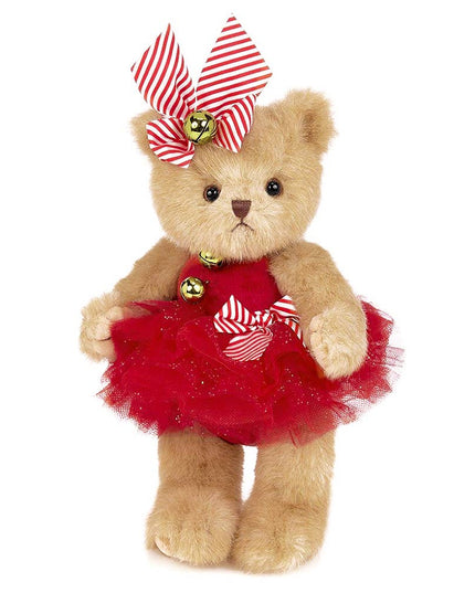 Teddy bear wearing a red dress with a striped bow on a white background