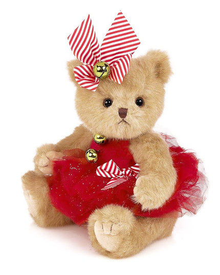 Teddy bear wearing a red dress with a striped bow on a white background