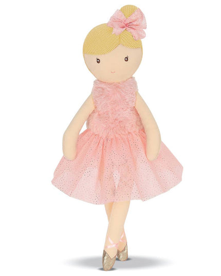 Doll in a pink dress with a bow on a white background