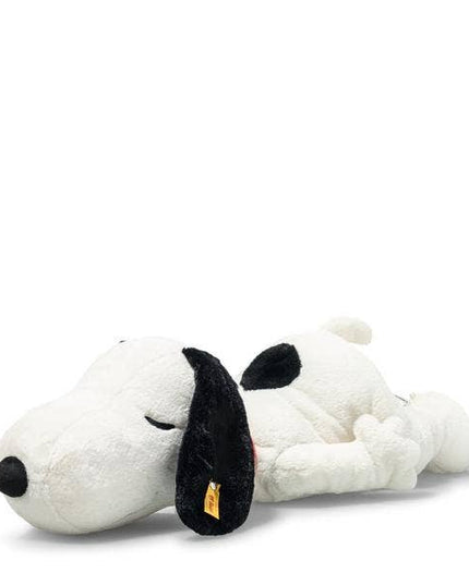 Plush toy resembling a dog with a black nose on a white background