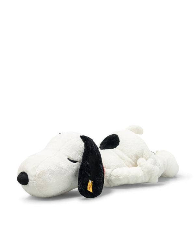 Plush toy resembling a dog with a black nose on a white background