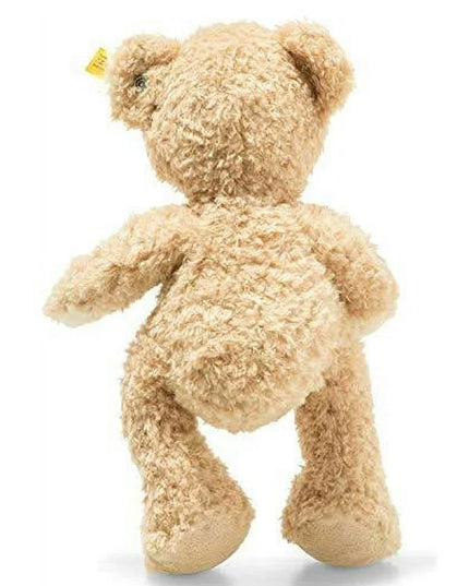 Beige teddy bear on a white background