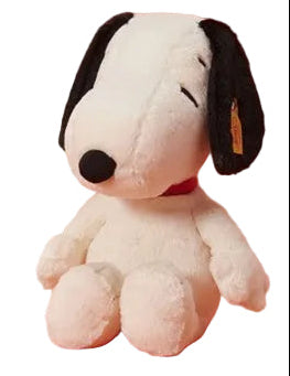 Plush toy resembling a dog with a black nose and ears on a white background