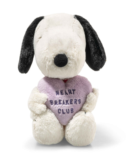 Stuffed dog toy with a heart-shaped 'Heart Breakers Club' pillow on a white background