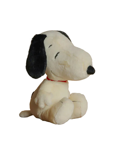 Plush toy resembling a dog with a black face and white body on a white background