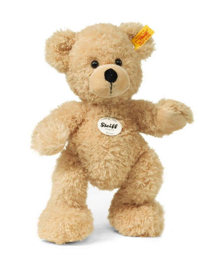 Plush teddy bear with a visible Steiff tag on a white background