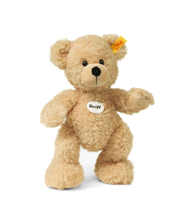 Plush teddy bear with a visible Steiff tag on a white background