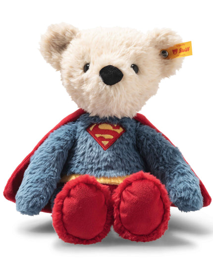 Plush bear toy with Superman cape and logo on a white background