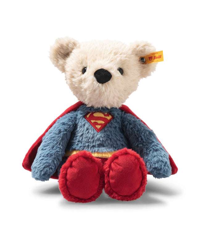 Plush bear toy with Superman cape and logo on a white background