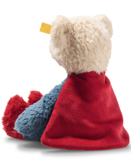 Plush toy with a red blanket draped over it on a white background