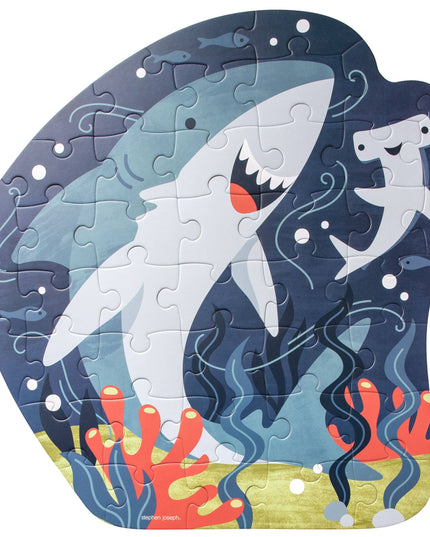 Shark-themed puzzle with ocean design on a white background