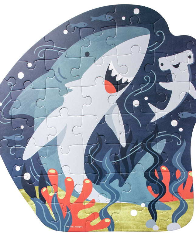 Shark-themed puzzle with ocean design on a white background