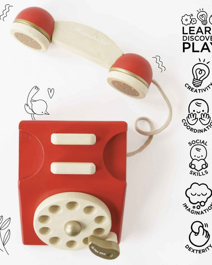Red and beige toy phone with educational icons on a white background