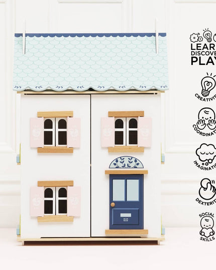 Model of a two-story house with a blue door and windows, featuring educational icons on a white background.