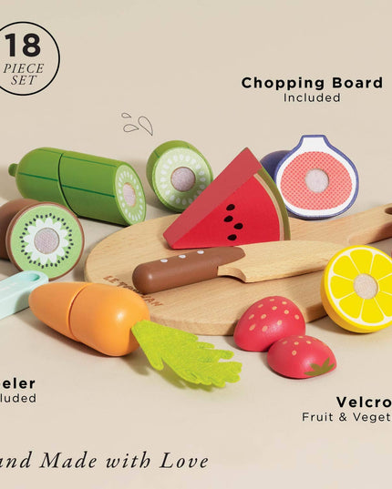 Set of toy fruits and vegetables with a wooden chopping board on a beige background