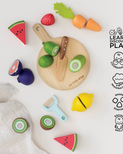 Colorful toy fruits and vegetables on a white background with 'LEARN DISCOVER PLAY' branding.