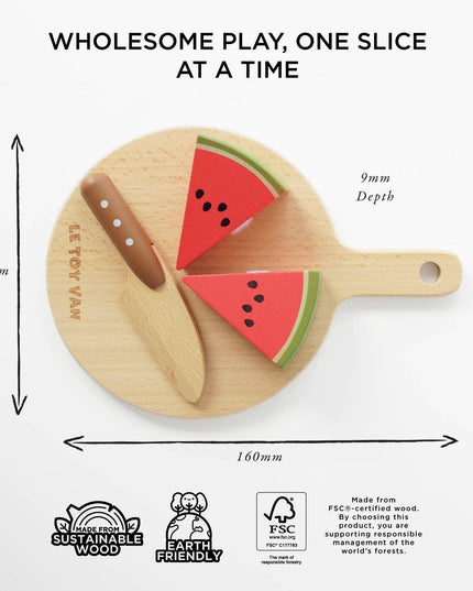 Wooden toy cutting board with watermelon slices and a knife, labeled 'Le Toy Van', on a white background.