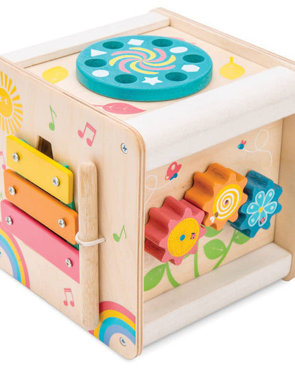 Colorful wooden toy cube with various sounds and activities on a white background