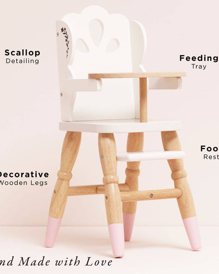 Wooden high chair with pink accents labeled on a light pink background