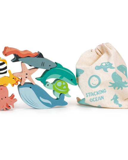Set of colorful wooden ocean-themed toys with a drawstring bag on a white background