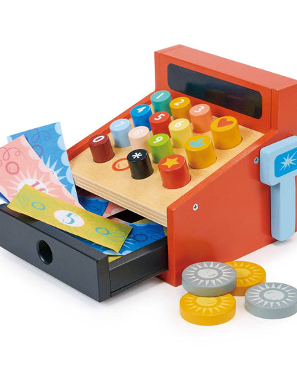 Toy cash register with colorful stamps and currency on a white background