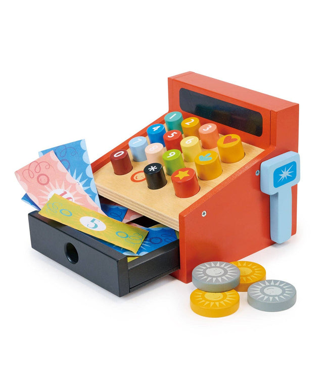 Toy cash register with colorful stamps and currency on a white background